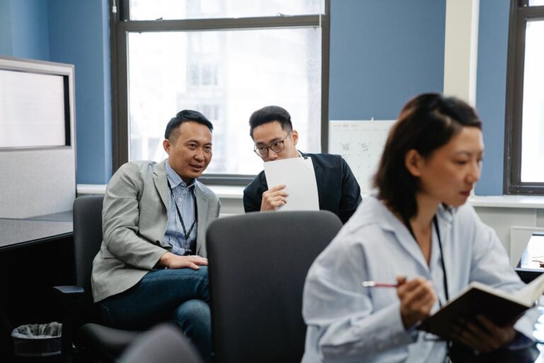 Male Employees gossiping with each other