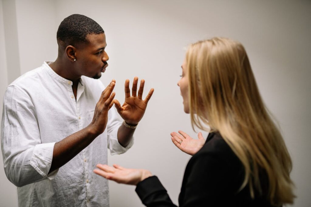 Man in White Dress Shirt Holding Womans Face