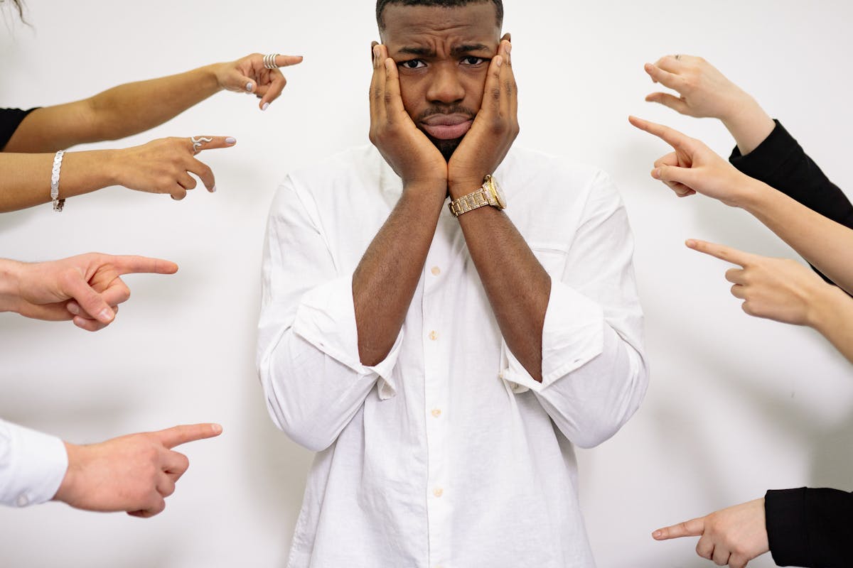 A Man Holding his Face