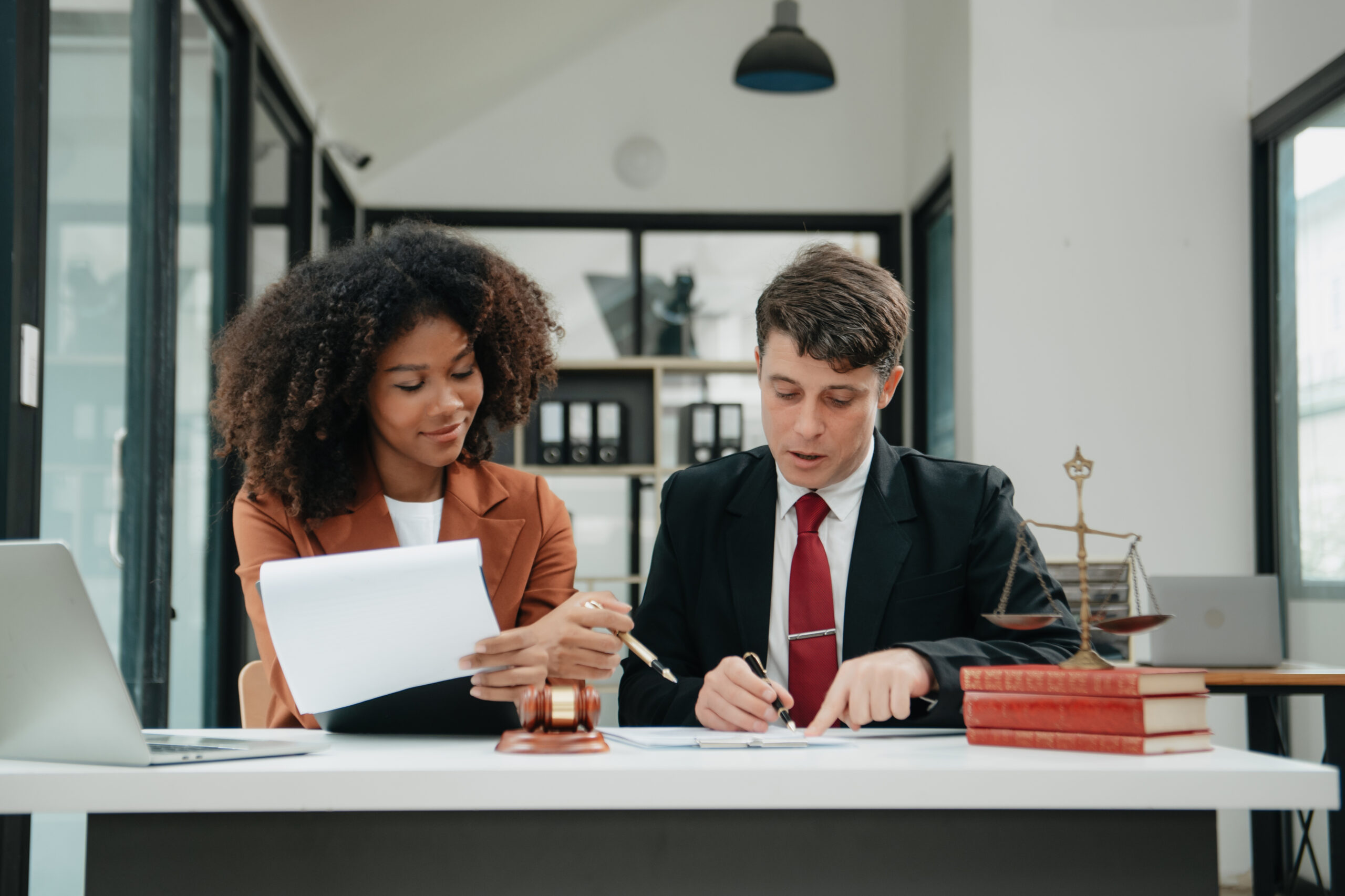 business team and lawyers discussing contract papers sitting at the table. Concepts of law, advice, legal services.